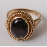 A modern 18ct gold and cabochon moonstone set dress ring, 7.4g, size N