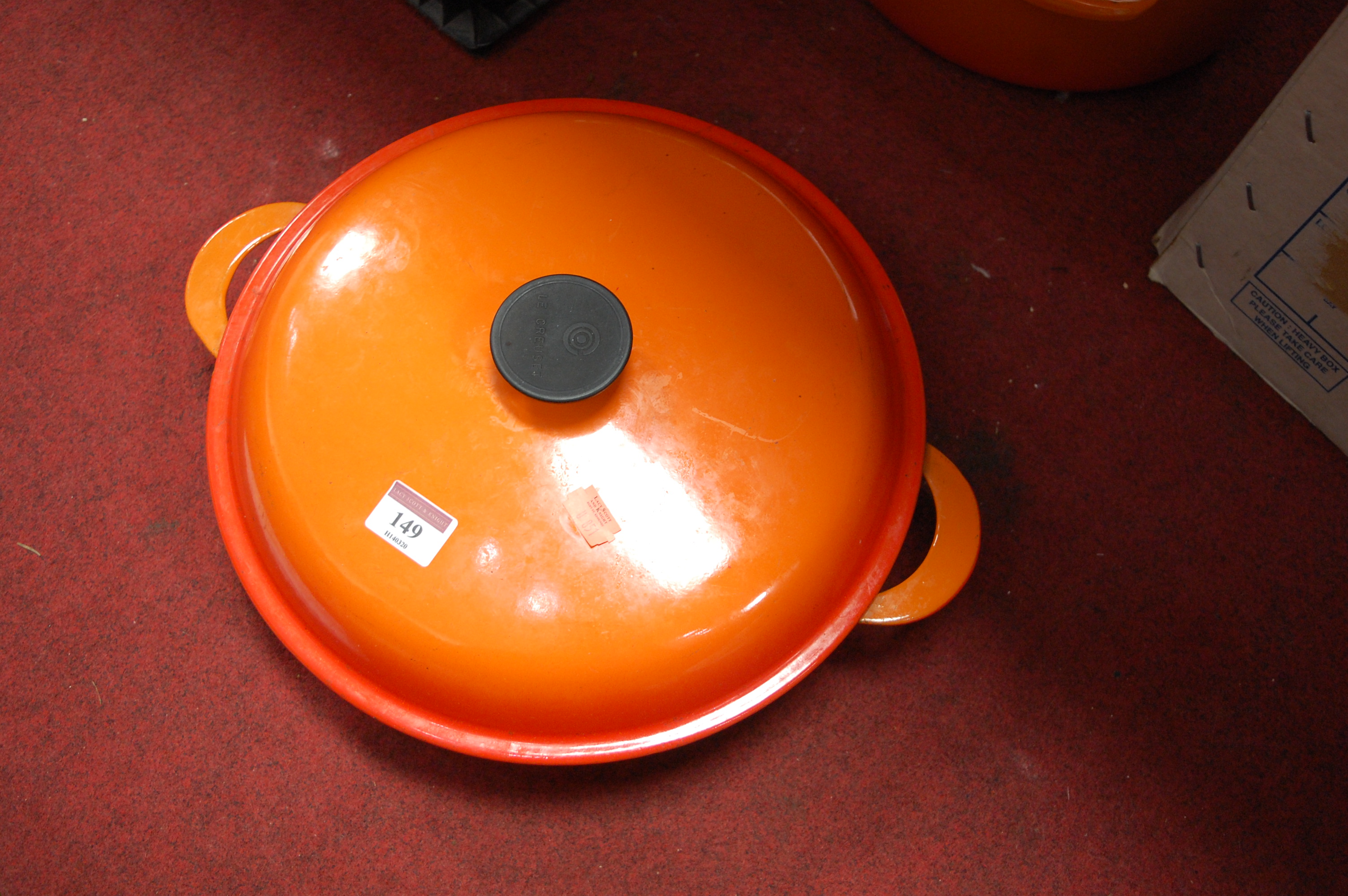 A Le Creuset orange enamelled casserole dish and cover together with one other smaller example (2) - Image 6 of 12