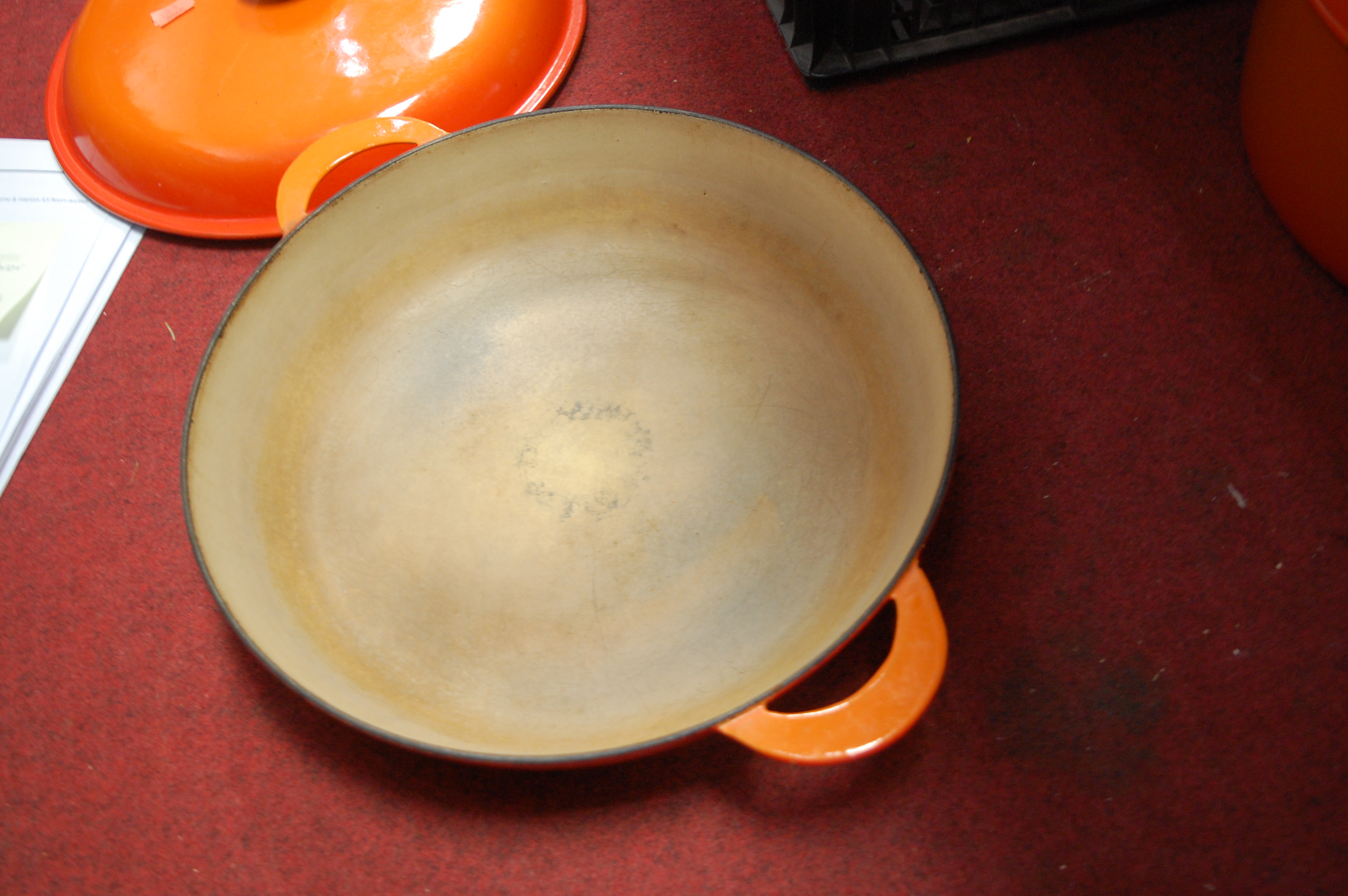 A Le Creuset orange enamelled casserole dish and cover together with one other smaller example (2) - Image 3 of 12