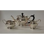 A George V bachelors silver three-piece tea service, of squat circular form, maker Mappin & Webb,