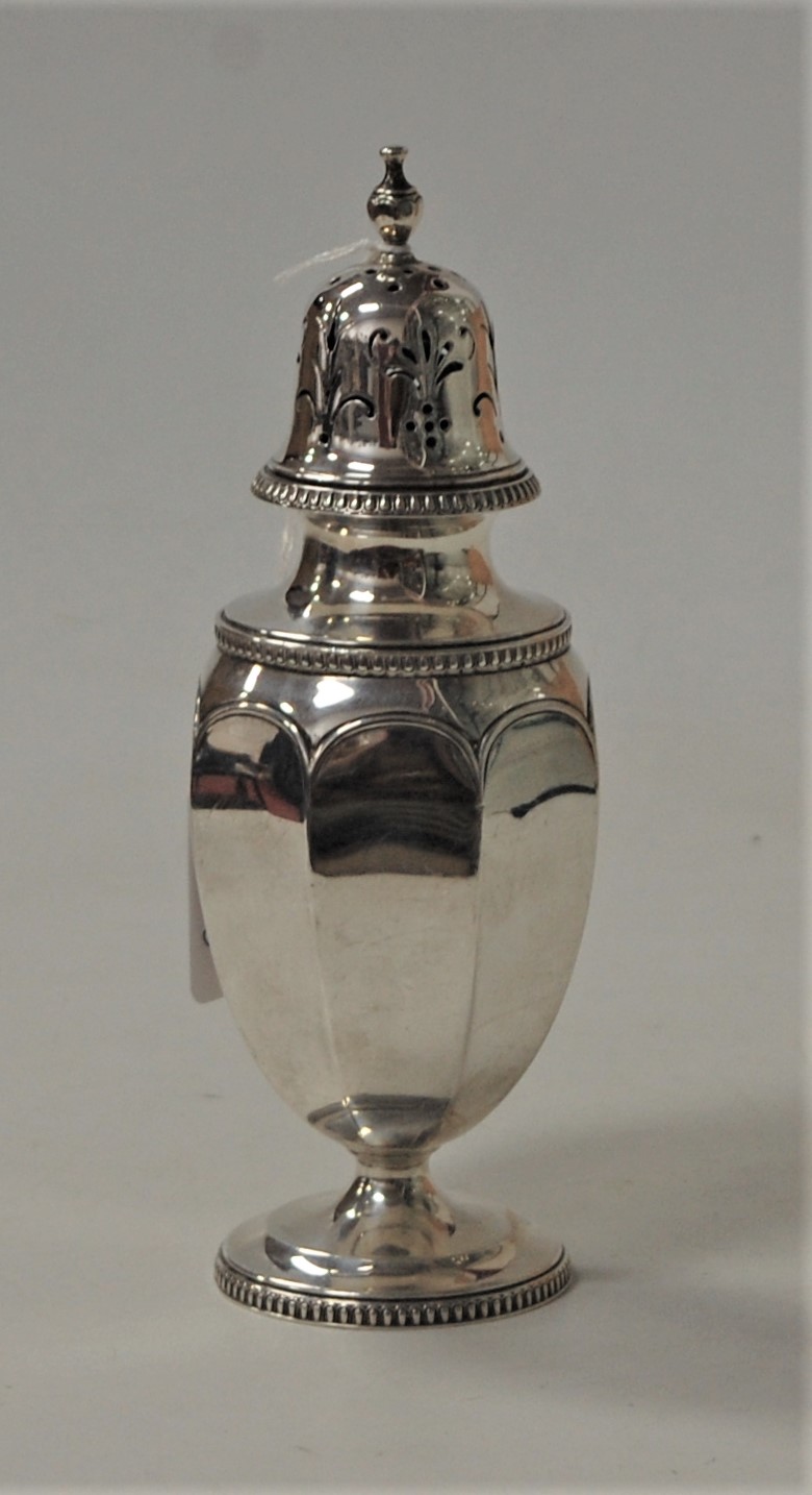 A George V silver pedestal lighthouse sugar sifter, having pierced cover and fluted body to circular