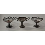 A pair of Edwardian silver pedestal bonbon dishes, each of shaped hexagonal form with pierced