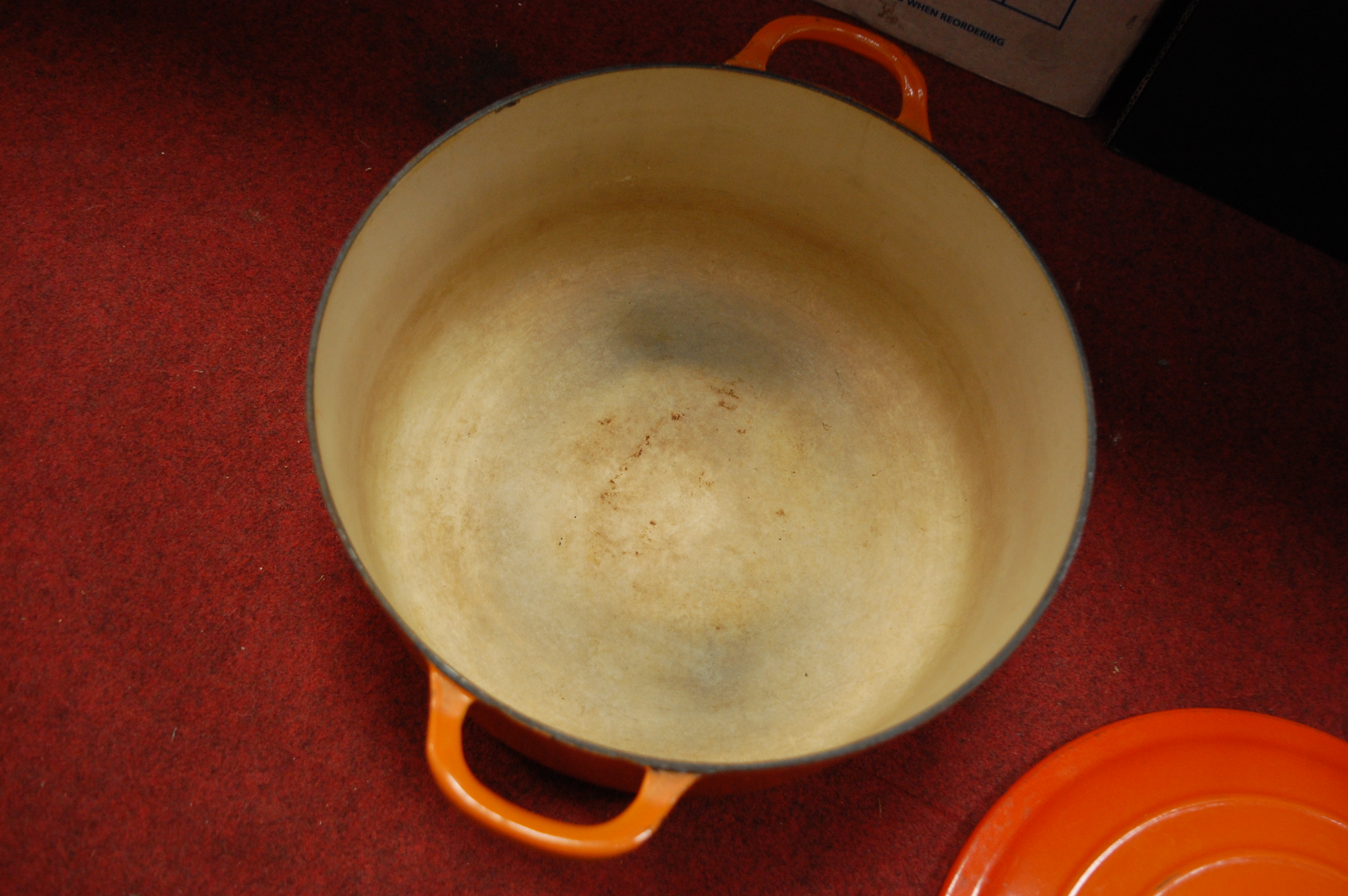 A Le Creuset orange enamelled casserole dish and cover together with one other smaller example (2) - Image 10 of 12