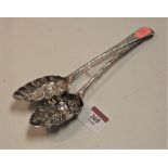 A pair of 19th century silver berry spoons, each having a shaped bowl with engraved stem, 3.7oz