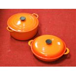 A Le Creuset orange enamelled casserole dish and cover together with one other smaller example (2)