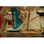 Two boxes containing a collection of miniature model boats