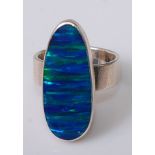 A contemporary silver and opal doublet(?) set dress ring, size M
