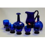 A small collection of Bristol blue glass ware to include mallet shaped decanter, set of six