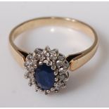 A modern 9ct gold, blue and white sapphire custer ring, 2.6g, size M