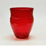 A large mid 20th century Whitefriars ruby glass vase in the Wave pattern, designed by Marriott