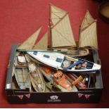 A scratch built model of a lifeboat together with various other yachts, trawlers etc