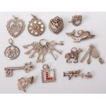 A quantity of assorted silver and white metal charms