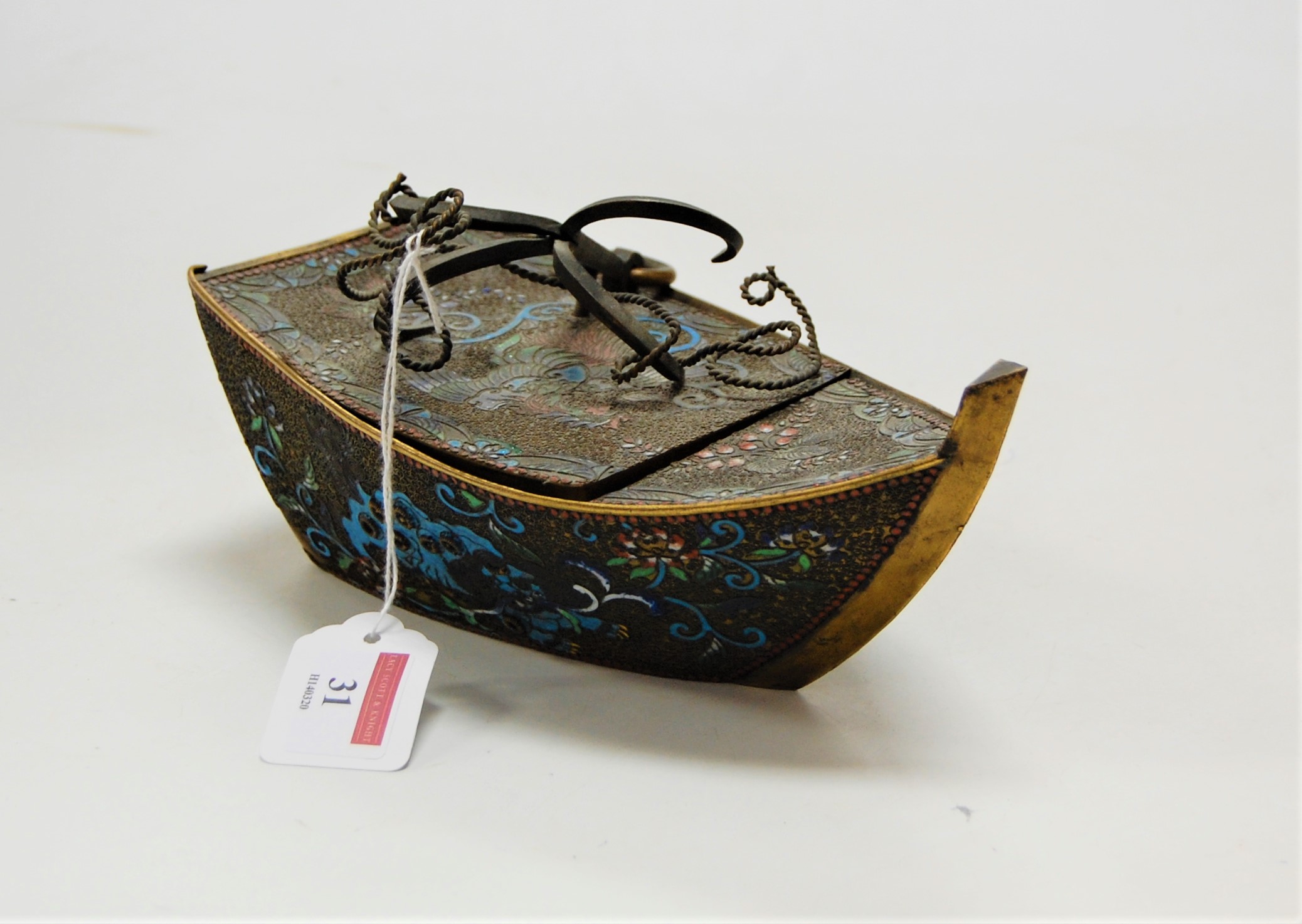 An early 20th century brass and cloisonne enamelled trinket box and cover in the form of a boat,