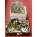 Two boxes of miscellaneous metalware to include brass hand bell, silver plated napkin rings, brass