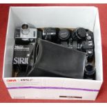 A collection of assorted cameras and accessories to include Nikon FM2 camera, with Nikkor 300mm