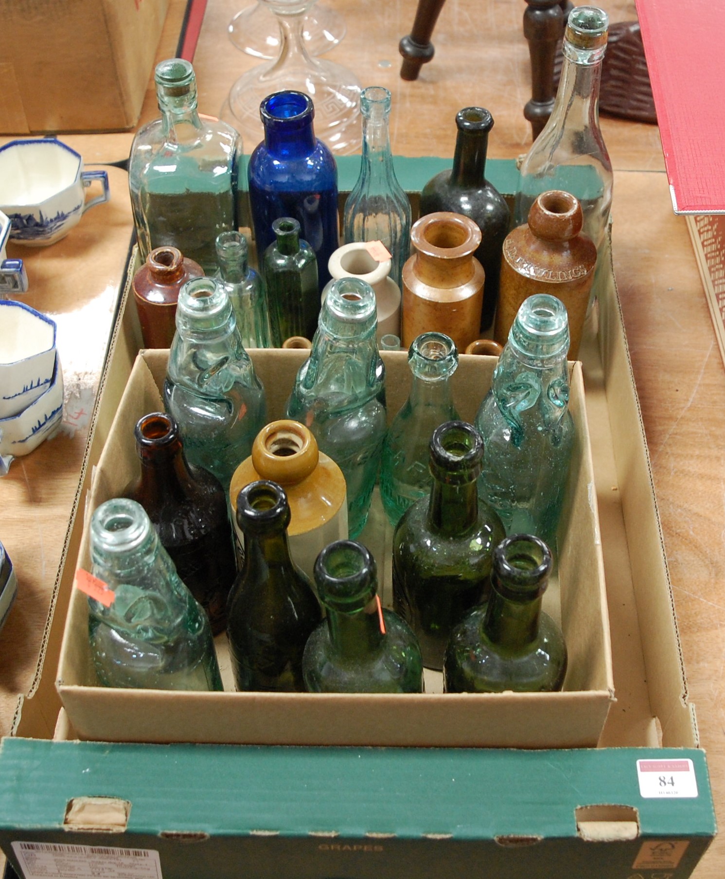 A collection of assorted glass and stoneware bottles to include Bloys & Sons, Sudbury, Suffolk, GW