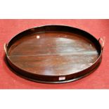 An early 20th century mahogany twin handled gallery tray of oval form, width 58cm