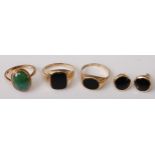Two gent's 9ct gold black onyx set signet rings; together with a lady's 9ct gold and jadeite set