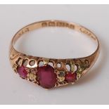 A vintage 9ct gold, ruby and diamond point set dress ring, the oval rubies in a carved setting, 1.