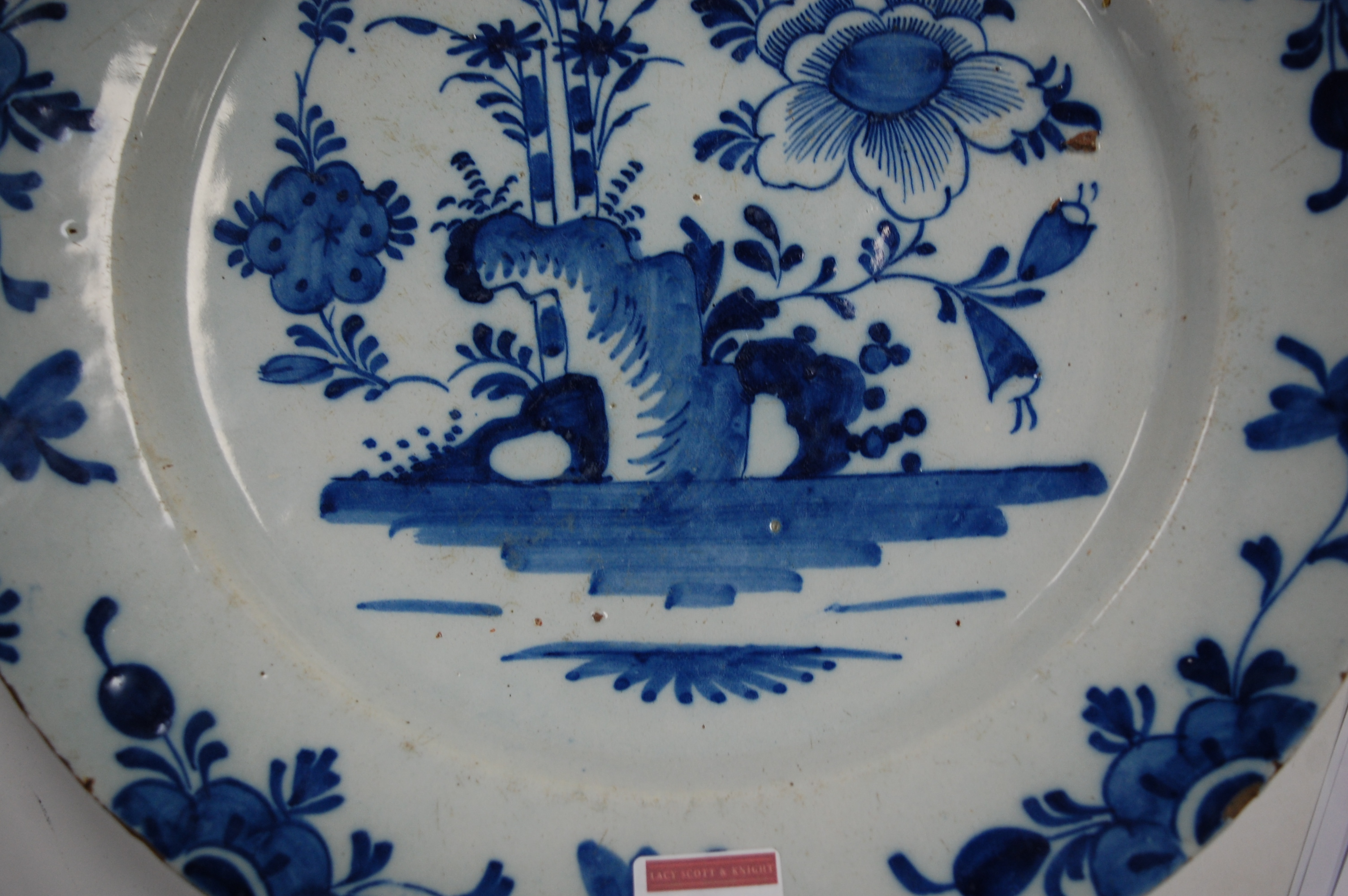 An 18th century English Delft blue & white charger, the centre typically decorated with flowers - Image 18 of 18