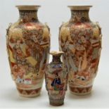 A pair of Japanese Taisho period Satsuma vases, each typically decorated with various figures within