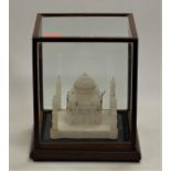 A carved stone model of the Taj Mahal in glazed display case, case dimensions width 31cm, depth