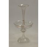 A Victorian glass table centrepiece having a trumpet shaped vase to circular bowl on domed footrim