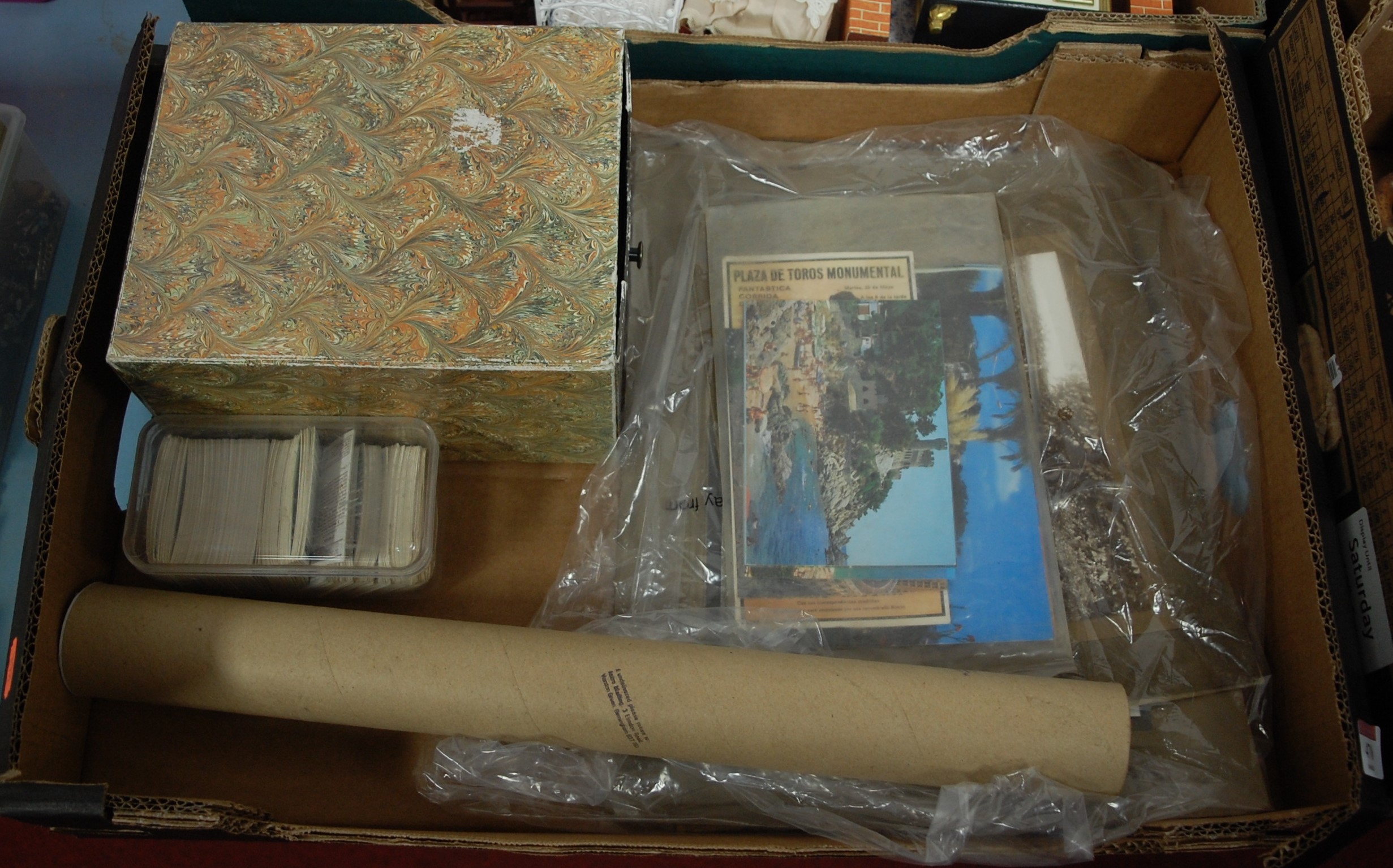 A box of miscellaneous items, to include various postcards, collectors cards etc