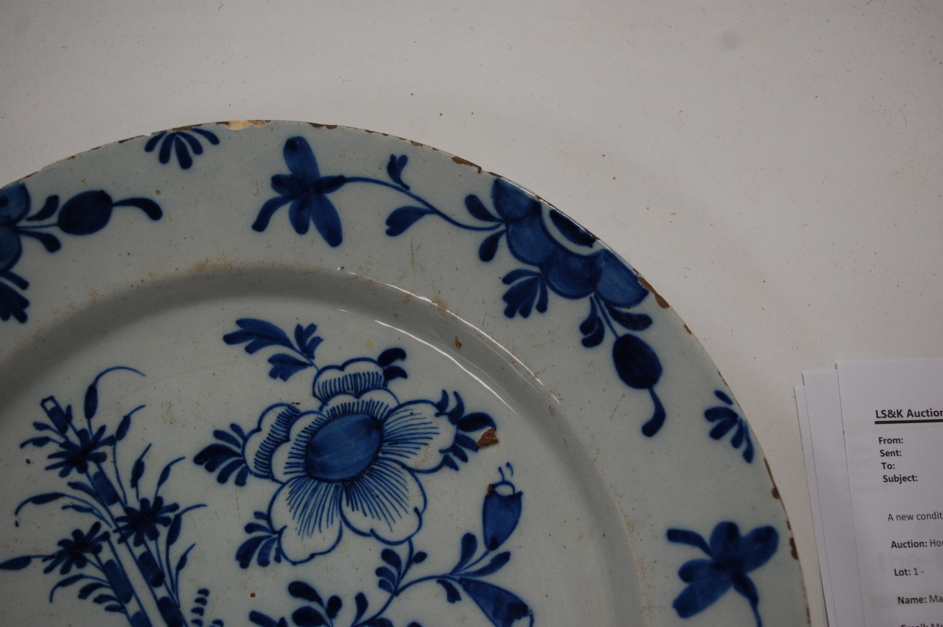 An 18th century English Delft blue & white charger, the centre typically decorated with flowers - Image 17 of 18