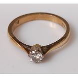 A 9ct gold diamond solitaire ring, the claw set round cut diamond weighing approx 0.25 carats, 2.1g,