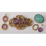 A Victorian pinchbeck and amethyst set brooch, with safety chain, 5.5cm (having several solder