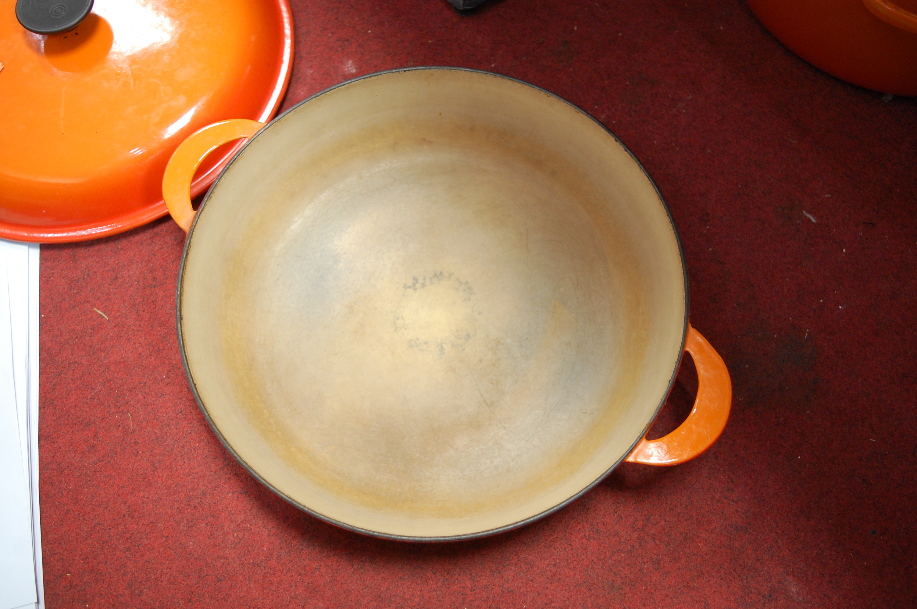 A Le Creuset orange enamelled casserole dish and cover together with one other smaller example (2) - Image 2 of 12