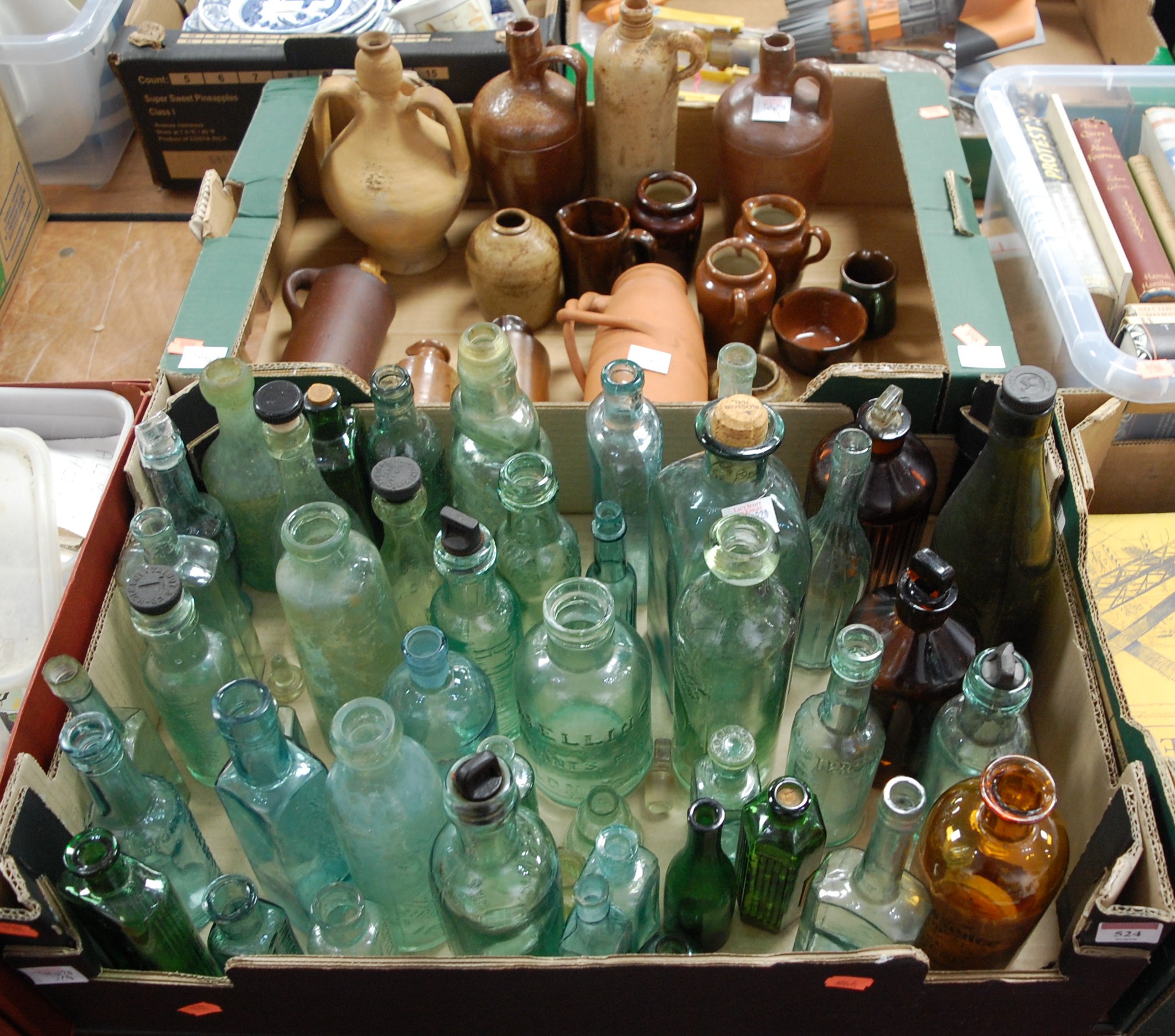 Two boxes of miscellaneous stoneware and glass bottles and flagons