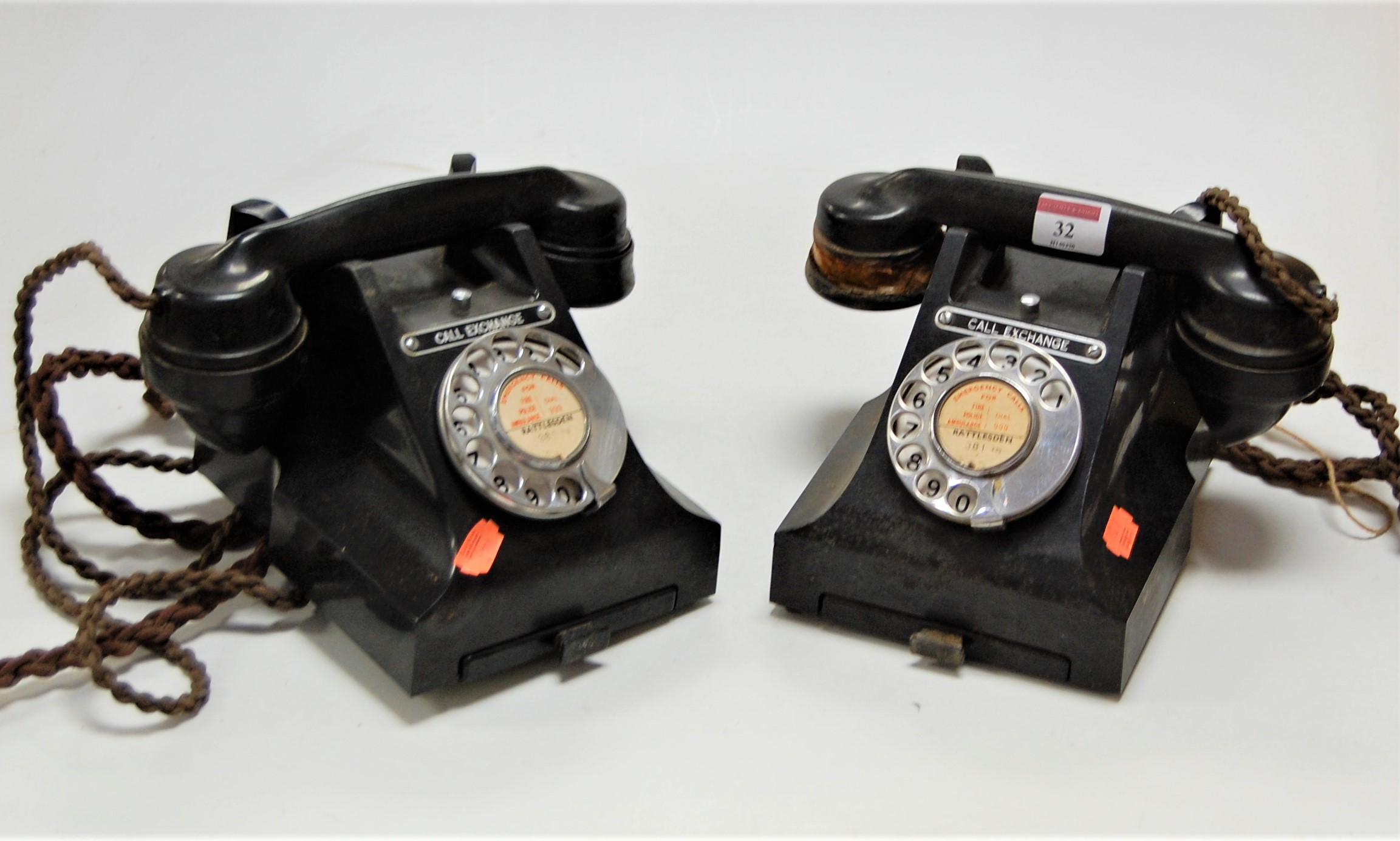 An early 20th century black bakelite cased telephone together with one other similar example (2)
