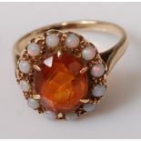 A 9ct gold, orange topaz(?), and opal set dress ring, 3.8g, size K