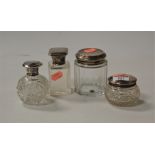 A George V scent bottle, having a cut glass body with glass stopper and silver cap; together with