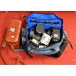 A collection of assorted cameras and accessories, to include Canon AV1, Canon AE1 Programme, Canon