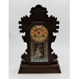 A late 19th century American walnut cased mantel clock by The Ansona Clock Co Ltd of New York,