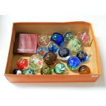A collection of assorted modern glass paperweights