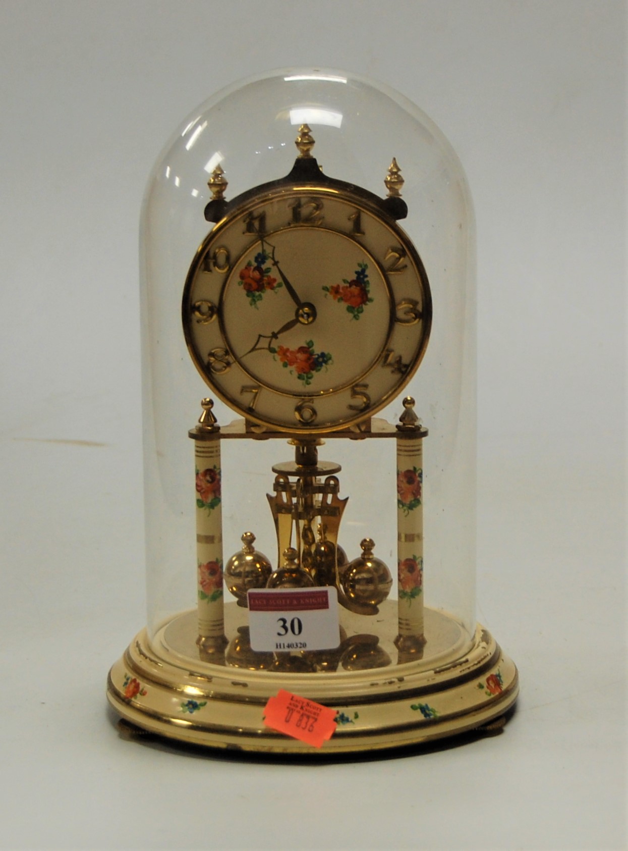 A mid 20th century lacquered brass and painted anniversary clock under glass dome, height 24cm