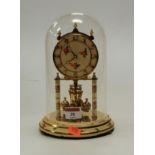 A mid 20th century lacquered brass and painted anniversary clock under glass dome, height 24cm