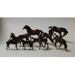 A collection of eleven various horse and foal figures, mainly being Beswick and in brown gloss