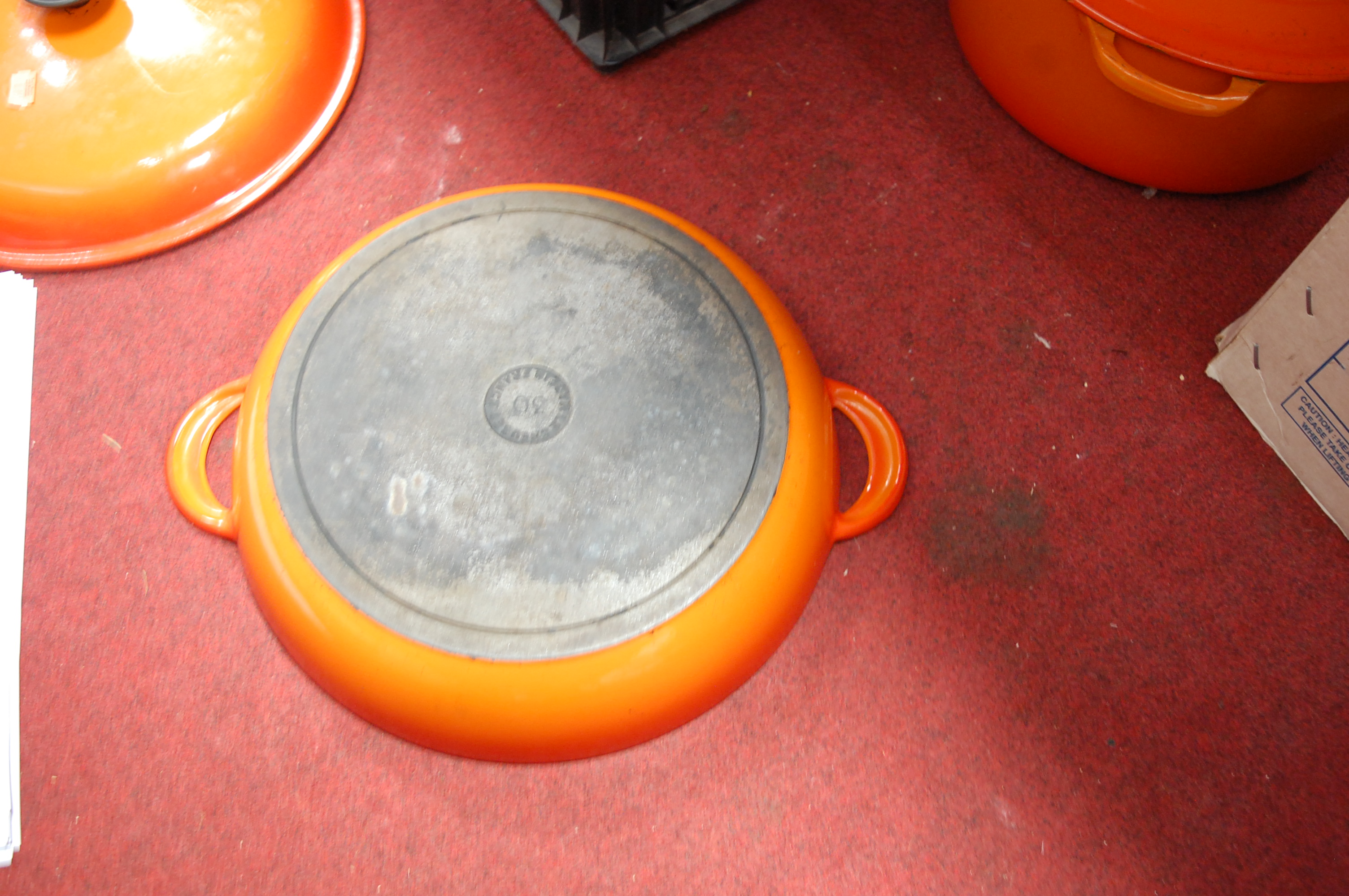 A Le Creuset orange enamelled casserole dish and cover together with one other smaller example (2) - Image 5 of 12