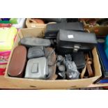 Three boxes containing a collection of cameras, binoculars and photography equipment, to include