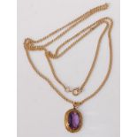 A modern 9ct gold flat curblink neck chain, having associated oval cut amethyst in yellow metal