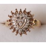A modern 9ct gold diamond cluster ring, arranged as an oval setting, band stamped total diamond