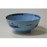 An 18th century delft bowl, blue and white decorated with a figure before a pagoda, dia.