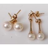 A pair of 18ct gold cultured pearl set ear studs; together with a pair of yellow metal and