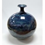 A large 20th century studio pottery vase of globular form on a mottled blue ground, height 41cm