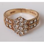 A modern 9ct yellow gold and white sapphire set dress ring, sponsors mark A&Co, 2.9g, size J